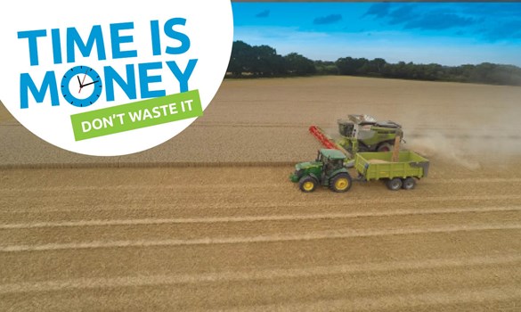 Combine harvester in a field